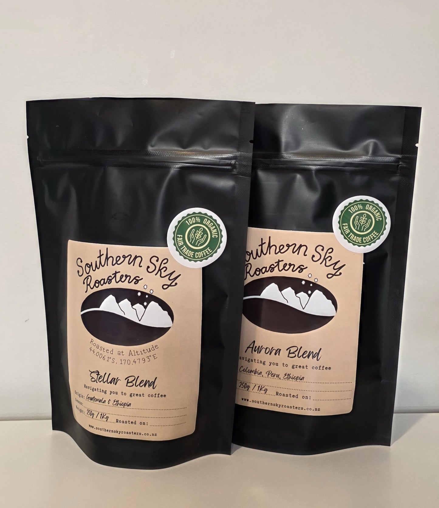 Two bags of coffee, both labelled 'Southern Sky Roasters' with 'Aurora Blend' & "Stellar Blend" written on them. The Aurora Blend is a blend of beans from Colombia, Peru and Ethiopia. The Stellar Blend is a blend of beans from Guatemala & Ethiopia. The black bags contain 250g of coffee.
Southern Sky Roasters
Artisan Roastery Lake Tekapo, New Zealand
Coffee
Southern Sky Roasters
Organic coffee
Artisan Roastery
Stellar Blend and Aurora Blend
Lake Tekapo New Zealand