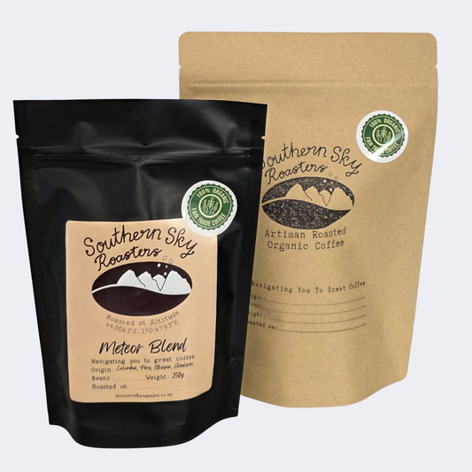 Two bags of coffee, both labelled 'Southern Sky Roasters' with 'Meteor Blend' written on them. The Meteor Blend is a blend of coffee beans from Honduras, Peru, Colombia & Ethiopia. The black bag is 250g, and the brown bag is 500 g.
Artisan Coffee 
Meteor Blend
Southern Sky Roasters
Mapua, New Zealand
Nelson, New Zealand
Richmond, New Zealand
Organic Fair Trade Coffee