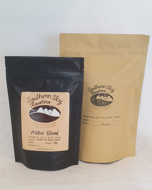 Two bags of coffee, both labelled 'Southern Sky Roasters' with 'Meteor Blend' written on them. The Meteor Blend is a blend of coffee beans from Honduras, Peru, Colombia & Ethiopia. The black bag is 250g, and the brown bag is 500 g.
Artisan Coffee 
Meteor Blend
Southern Sky Roasters
Lake Tekapo, New Zealand
Organic Fair Trade Coffee